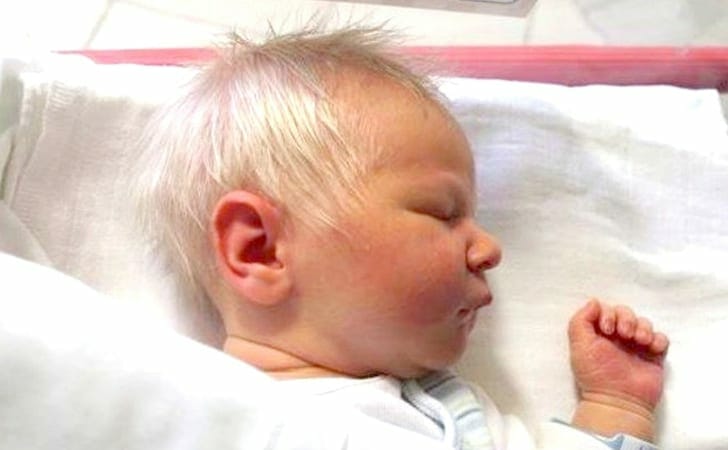Baby born with full head of gray hair wins the hearts of all around him