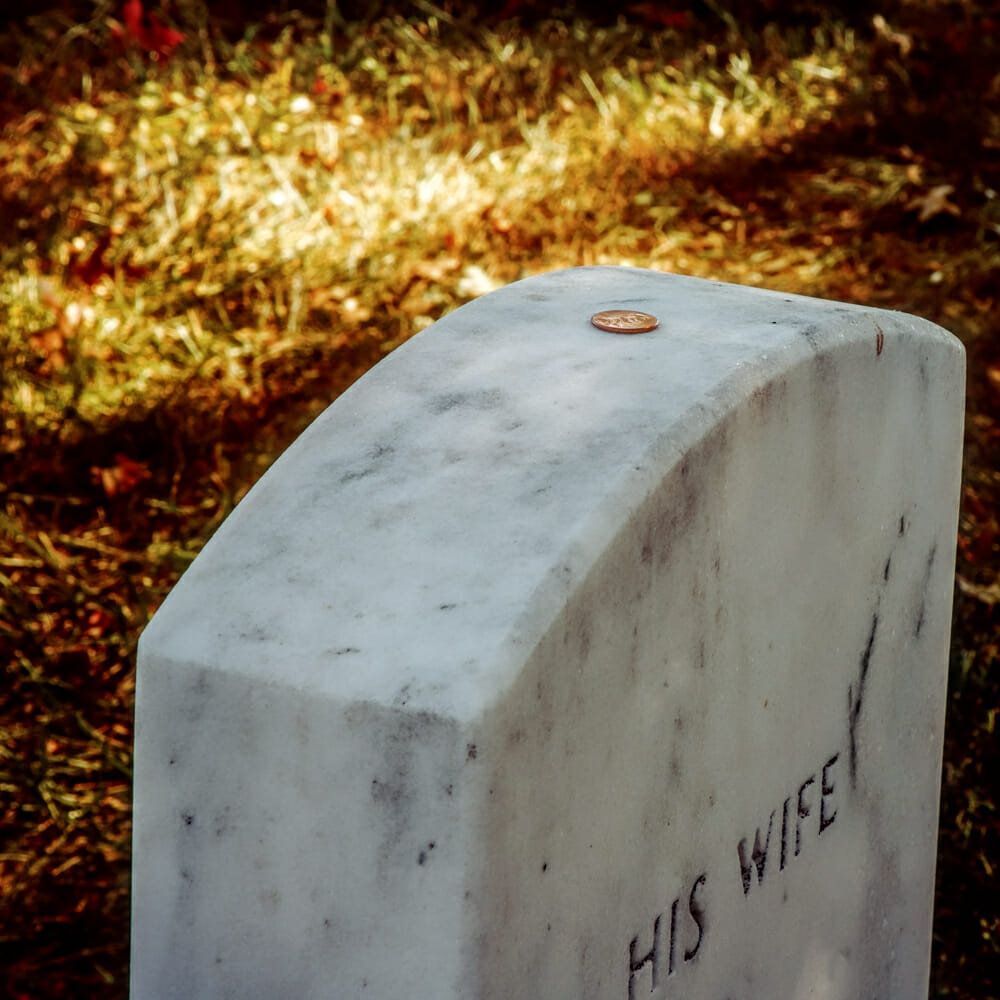 Coins on gravestones Here's why you should never, ever take one