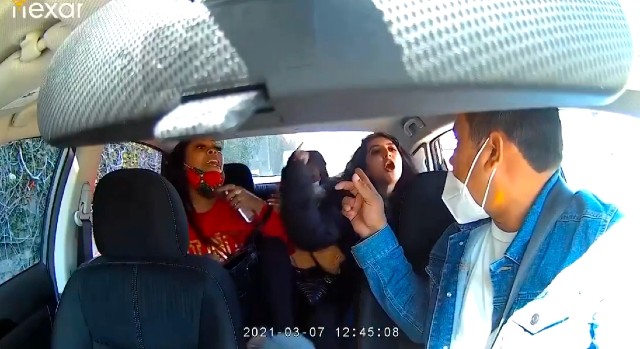 Woman who coughed on Uber driver in viral video turns herself in to police