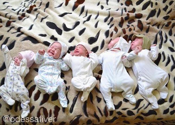 The photo shows newborn quintuplets