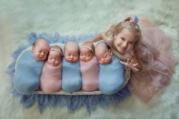 The photo shows quintuplets with their older sister